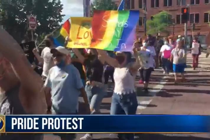 City rallies around LGBTQ community after man tears down Pride flag ...